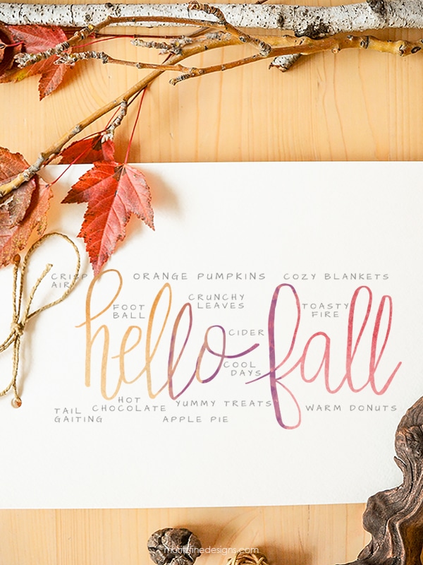 It's easy to decorate for fall with this free Hello Fall Watercolor Printable. Add it to a frame and put it on your mantle for the perfect fall decor.